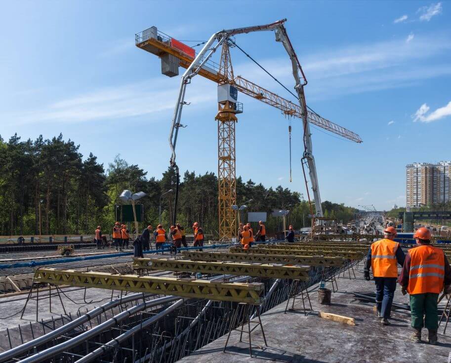 A group of men standing on top of a construction site